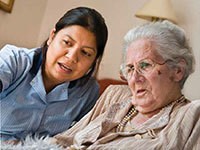 Resident and carer in care home